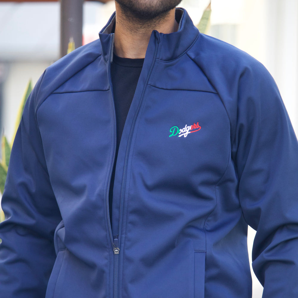 Person wearing a blue jacket with a logo on the chest