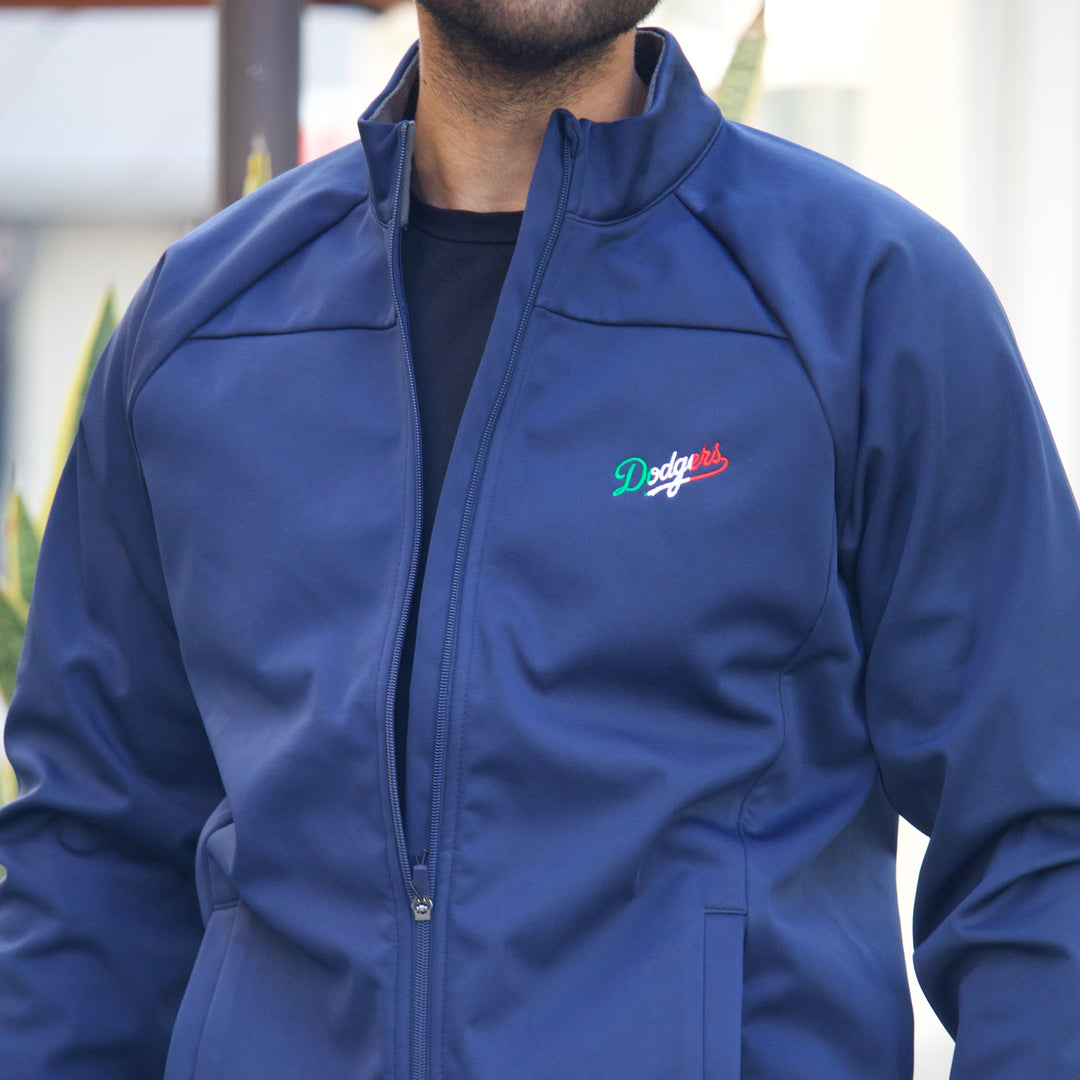 Person wearing a blue jacket with a logo on the chest